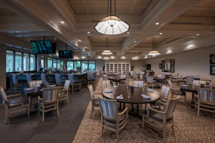 Upgraded bar and dining room at Cherokee Country Club featuring integrated audio and video systems for events and member experiences