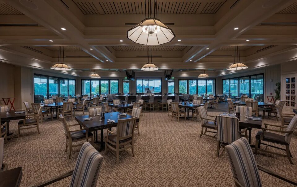 Multiple dining zones at Cherokee Country Club enhanced with zoned audio and sleek display integration