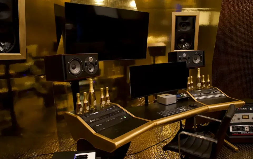 Immersive AV control studio with layered gold panels designed for branded content creation