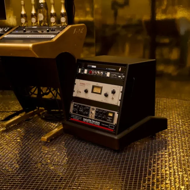 Custom amplifier rack supporting high-fidelity sound and AV performance in the Sovereign studio