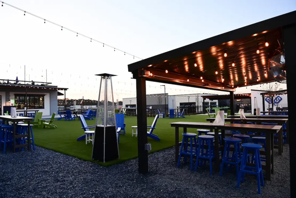 Outdoor social dining and pickleball area with seamless Wi-Fi coverage at private club